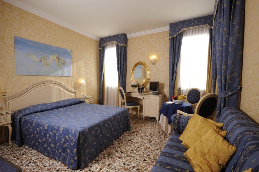 Voodi või voodid majutusasutuse Hotel Ca' Formenta toas