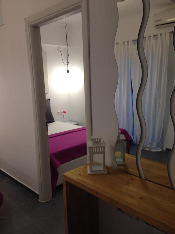 Łóżko lub łóżka w pokoju w obiekcie Philoxenia Suites