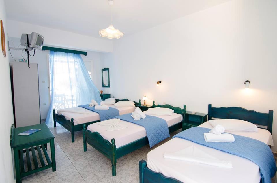 A bed or beds in a room at Pension Christina