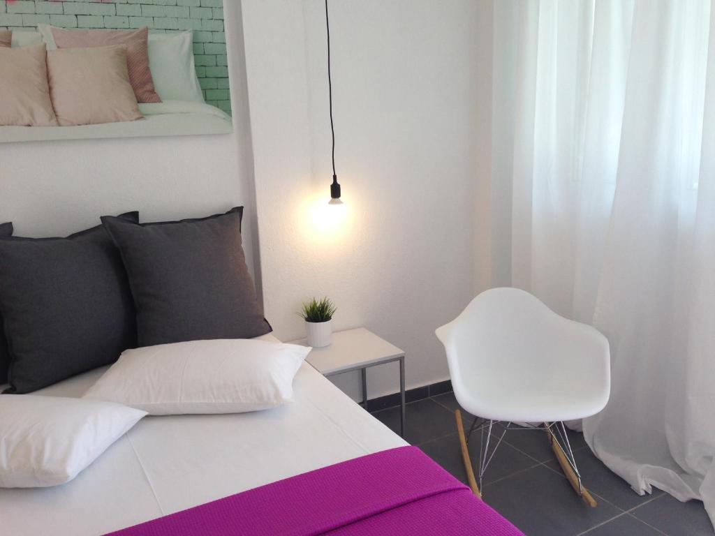 Łóżko lub łóżka w pokoju w obiekcie Philoxenia Suites