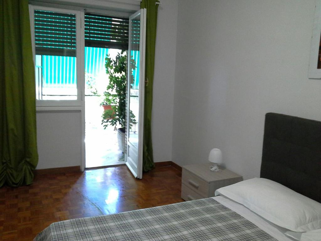 Posteľ alebo postele v izbe v ubytovaní Olimpica Relais guest house