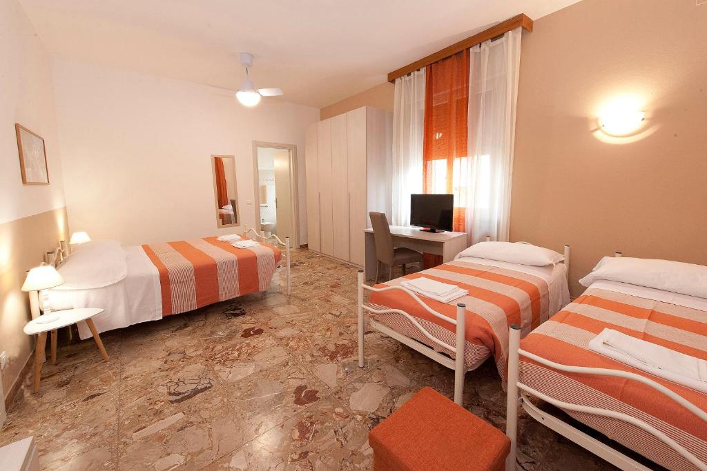Posteľ alebo postele v izbe v ubytovaní Gardenia Guest House