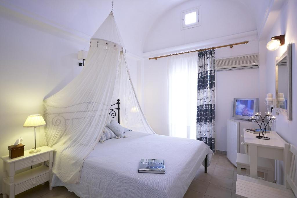 Een bed of bedden in een kamer bij Hotel Matina