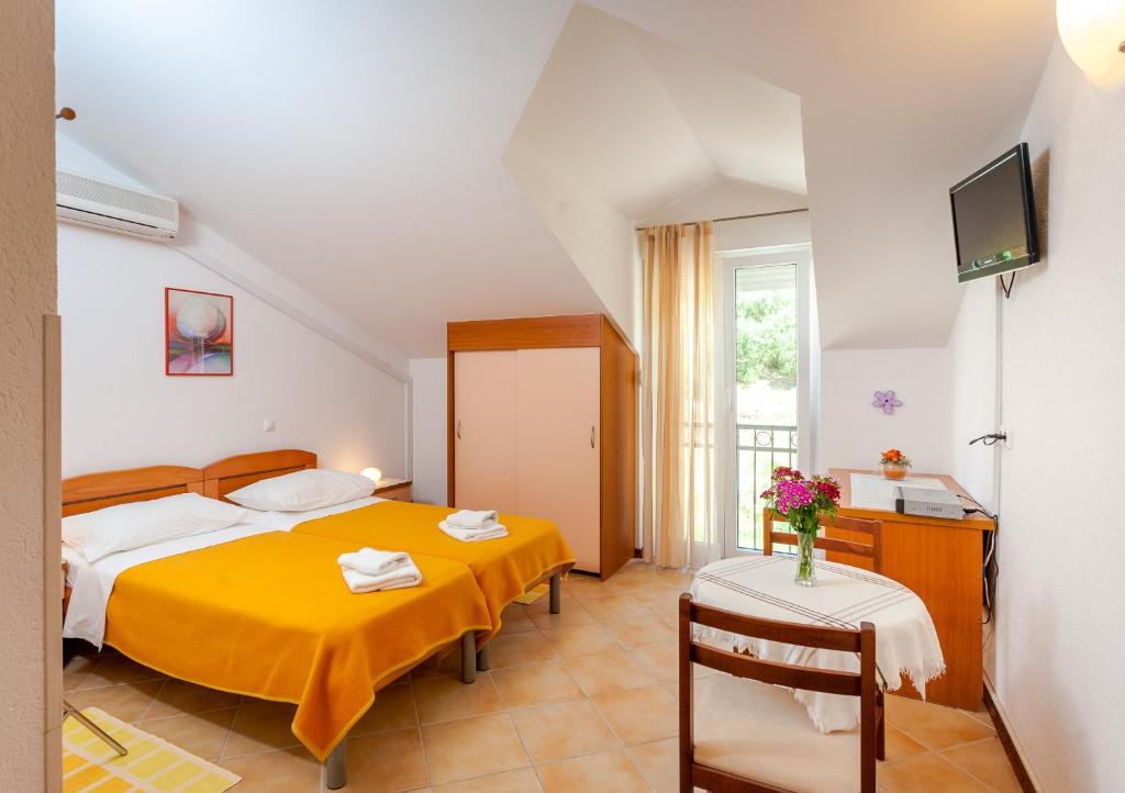 Postel nebo postele na pokoji v ubytování Guest House Davor Tomas