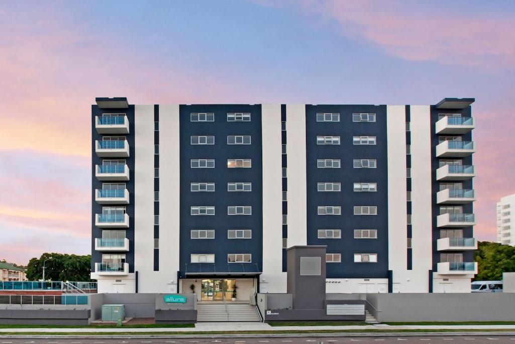 a large building with balconies on the side of it at Marina View Apartment in Townsville