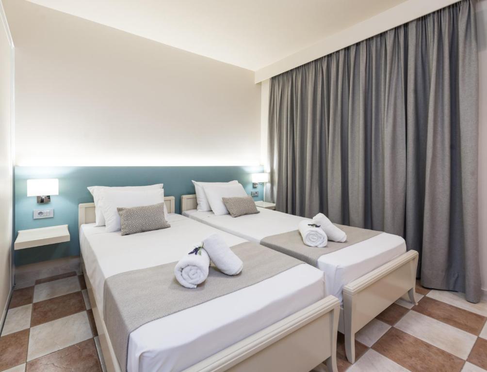 Postel nebo postele na pokoji v ubytování Ilios Hotel, Adults Only