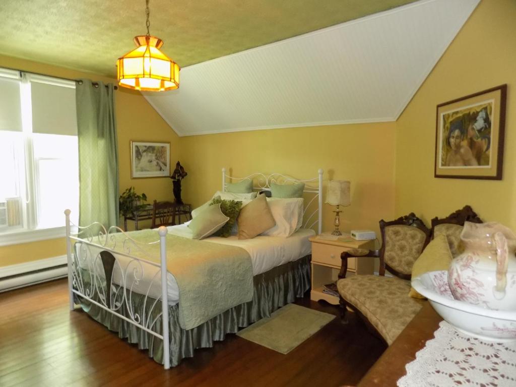 Postel nebo postele na pokoji v ubytování À L'Ancestrale B&B