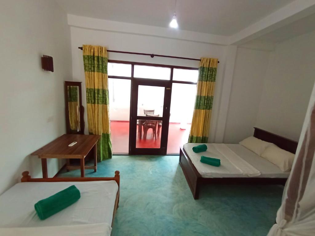 Ένα ή περισσότερα κρεβάτια σε δωμάτιο στο Chenaya Guest House