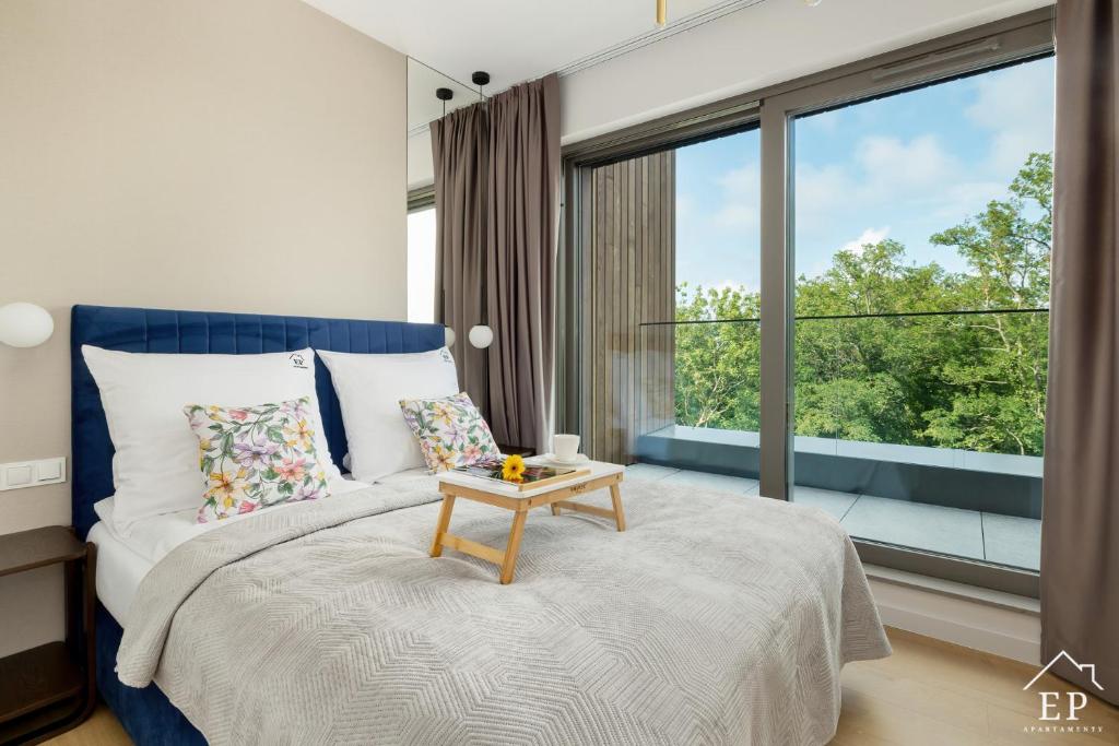 Ένα ή περισσότερα κρεβάτια σε δωμάτιο στο Apartamenty WIDOKOWY VIP Sand Dunes Dziwnów 60m od plaży EPapartamenty