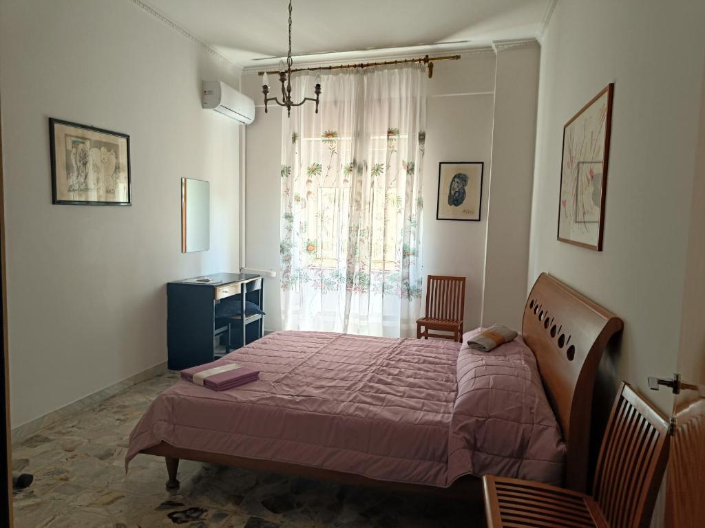 Postel nebo postele na pokoji v ubytování Appartamento Panoramico Corigliano Paese