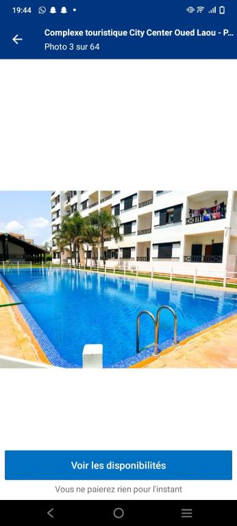 a screenshot of a website of a swimming pool at Appartement a Oued laou complexe cité cinter in Oued Laou