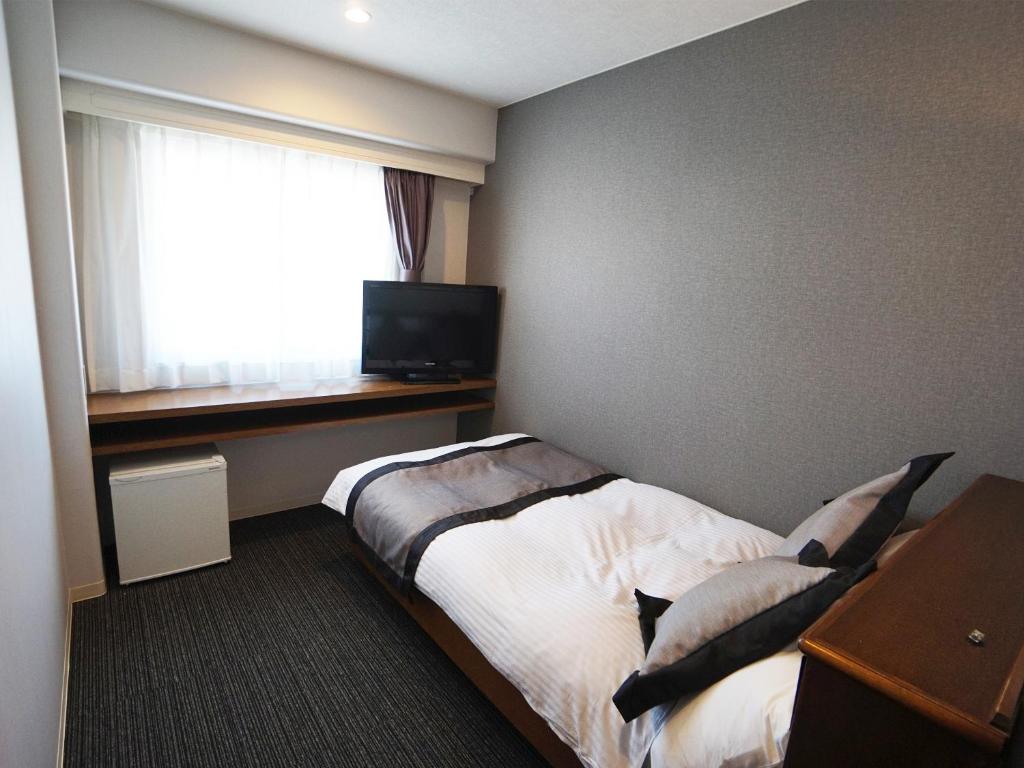 TV a/nebo společenská místnost v ubytování Hotel Areaone Kochi