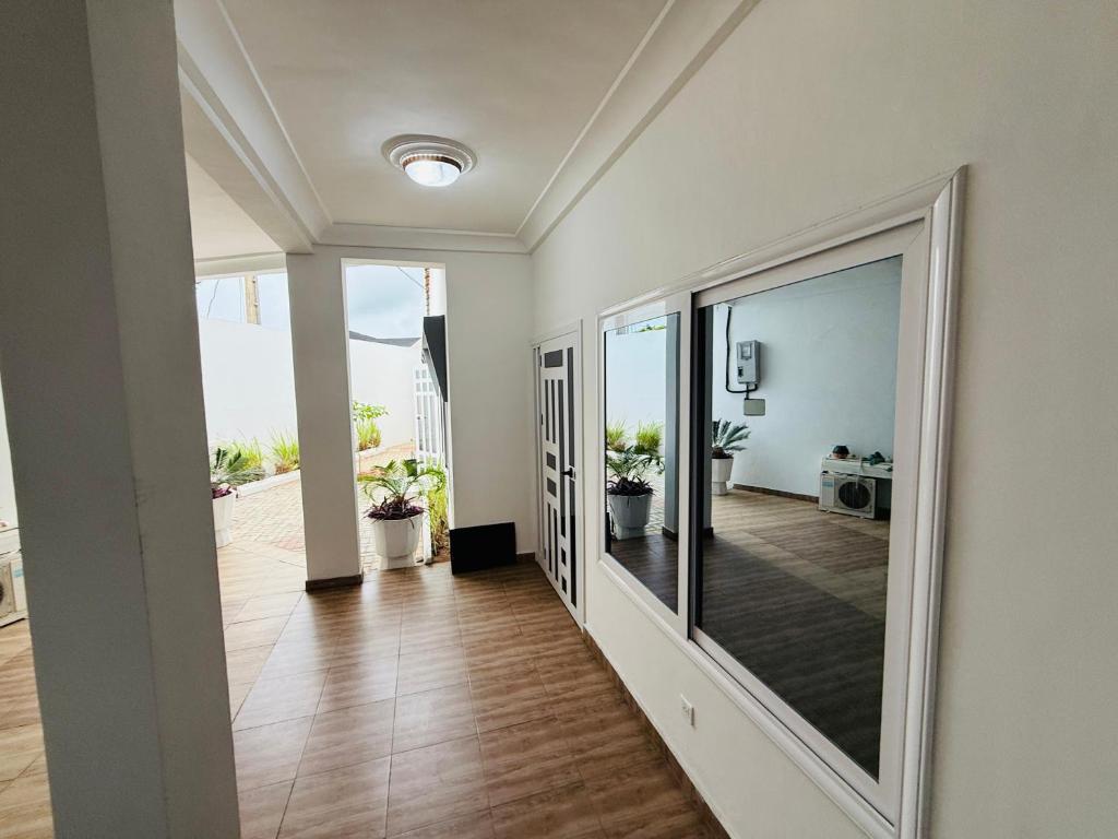Postel nebo postele na pokoji v ubytování RÉSIDENCE LUXORIA Cotonou