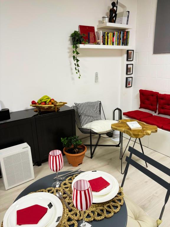 a living room with red and white plates on a table at Cheap Quiet Double Room in Park Royal with off-site Gym Access to Showers in London