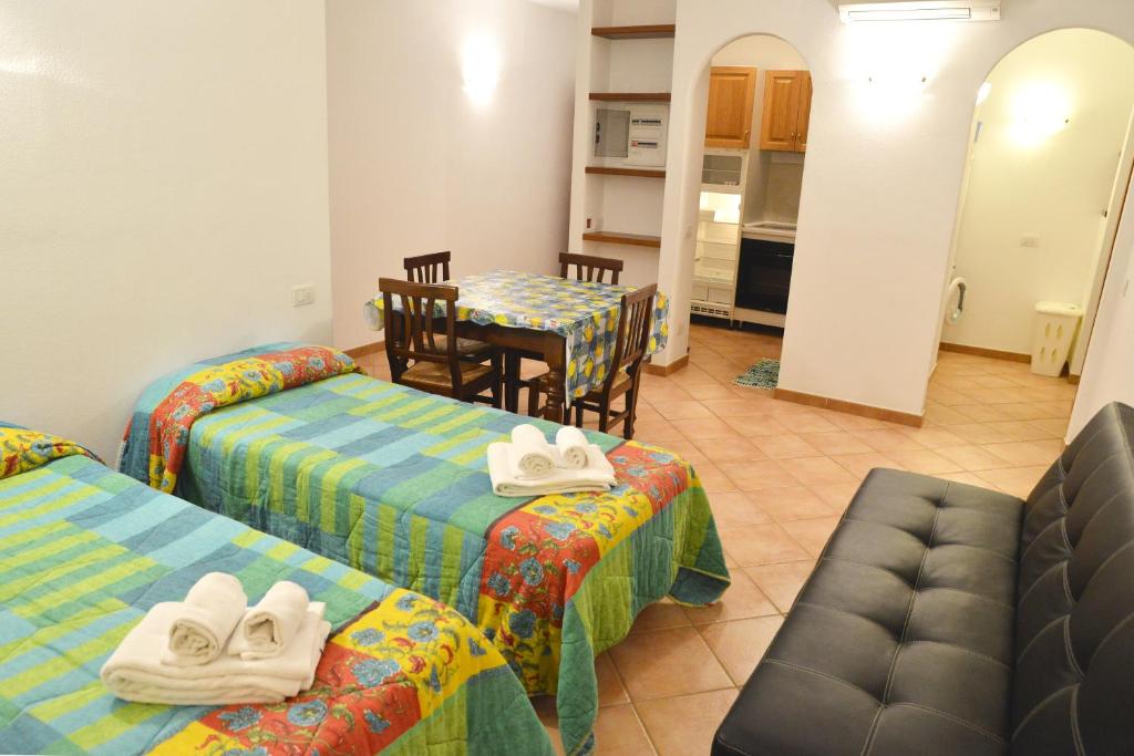 A bed or beds in a room at Appartamenti Galatea