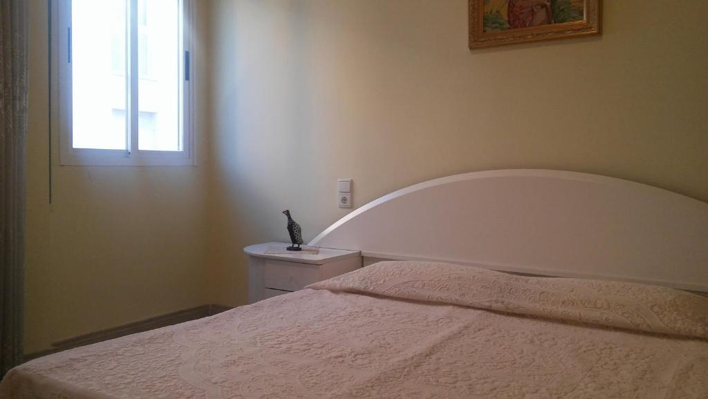 Postel nebo postele na pokoji v ubytování Passeig Maritim Apartment