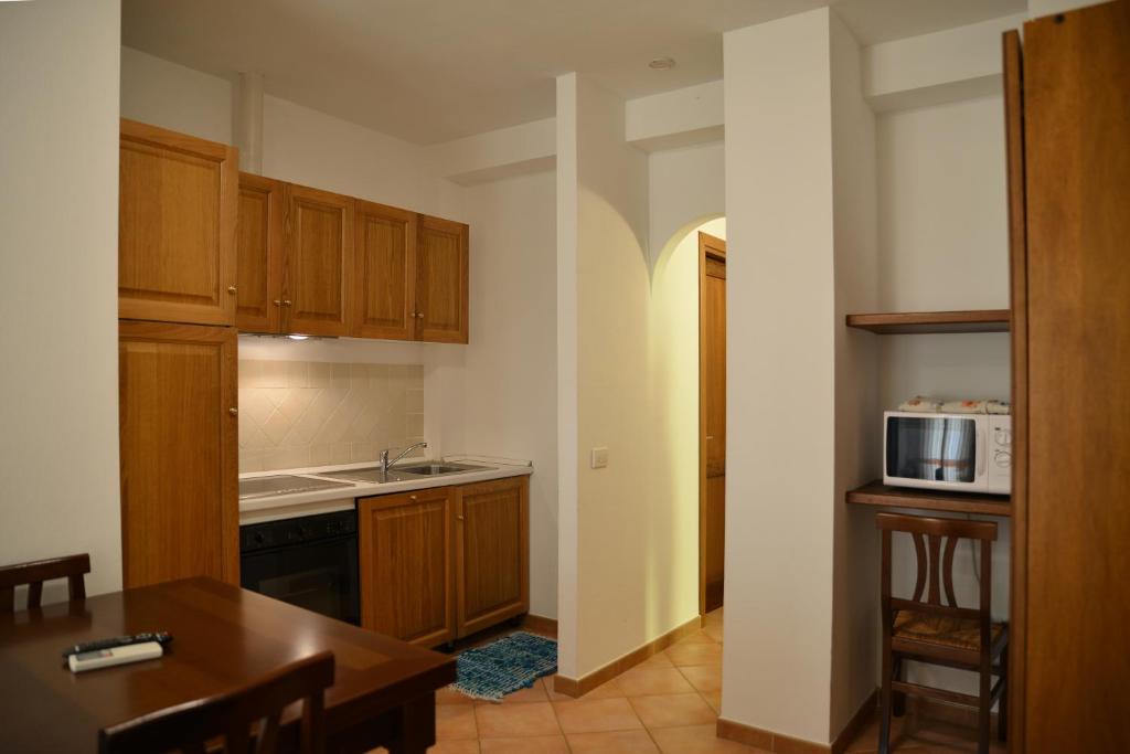 A kitchen or kitchenette at Appartamenti Galatea
