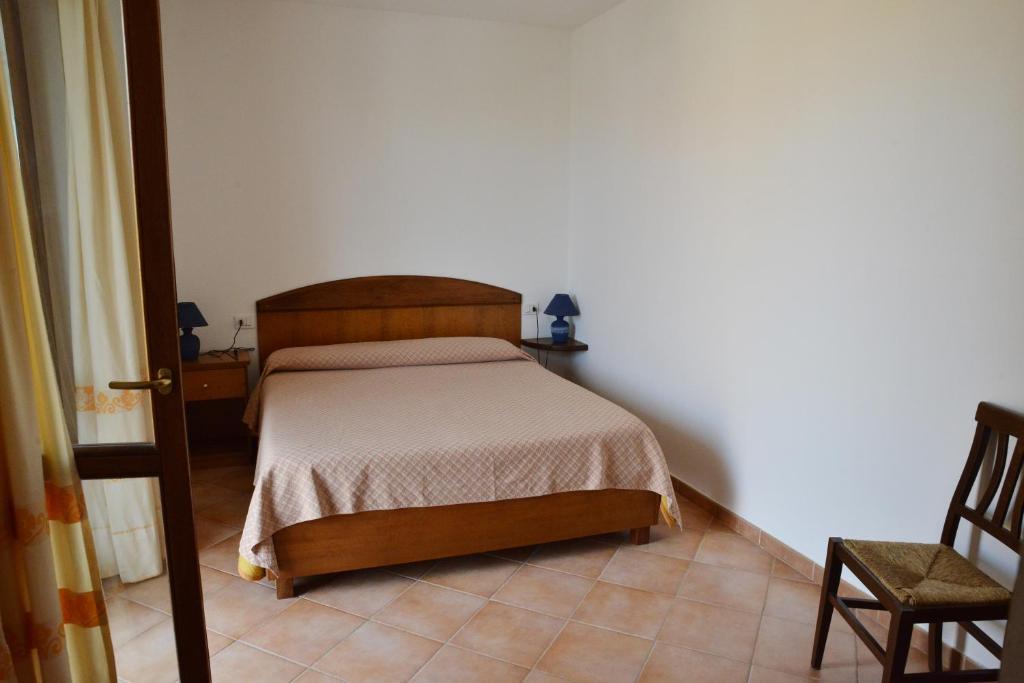 A bed or beds in a room at Appartamenti Galatea