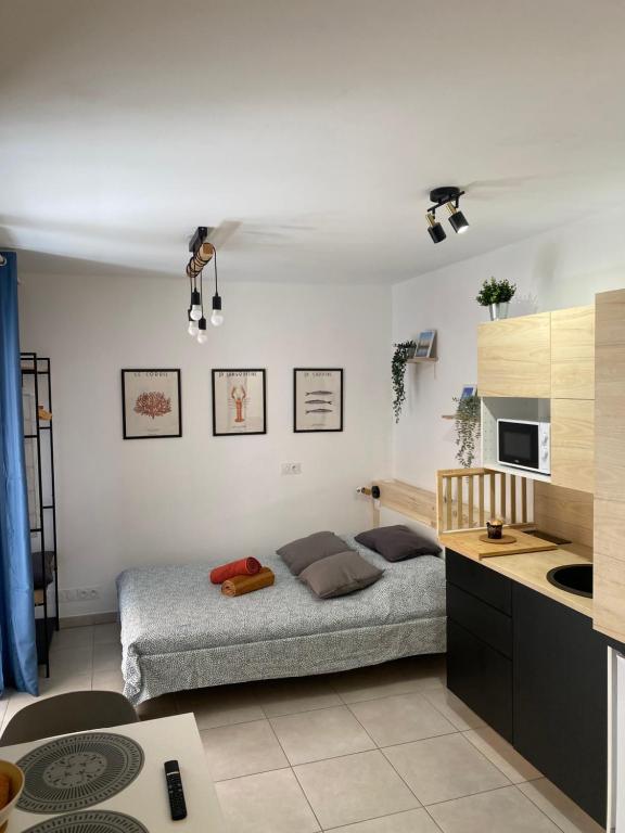 Ένα ή περισσότερα κρεβάτια σε δωμάτιο στο Quai N3 Studio, Parking, Vieux Port de La Ciotat