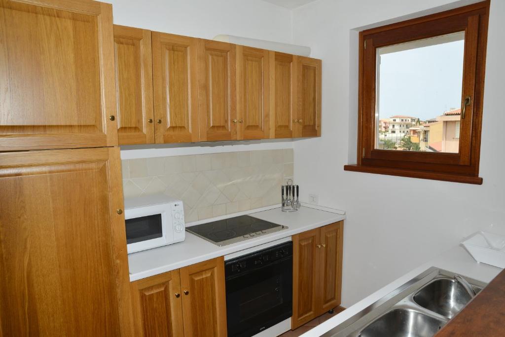 A kitchen or kitchenette at Appartamenti Galatea