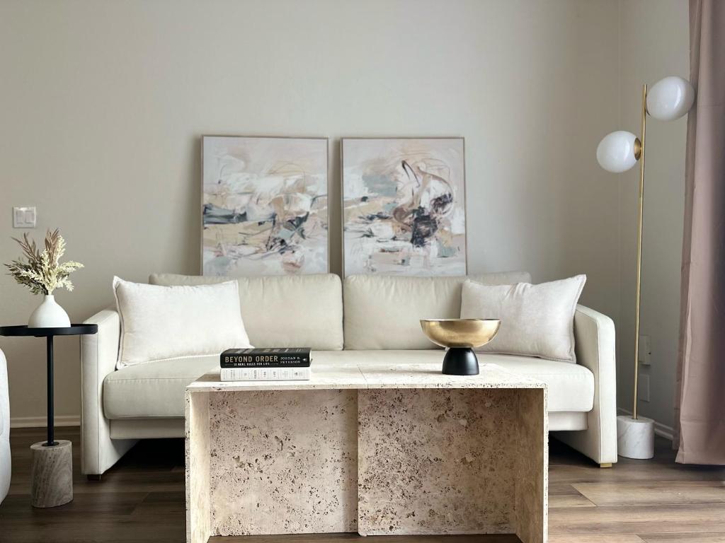 a living room with a couch and a coffee table at The Hideaway in MDR, FREE Parking, Heated Pool in Los Angeles