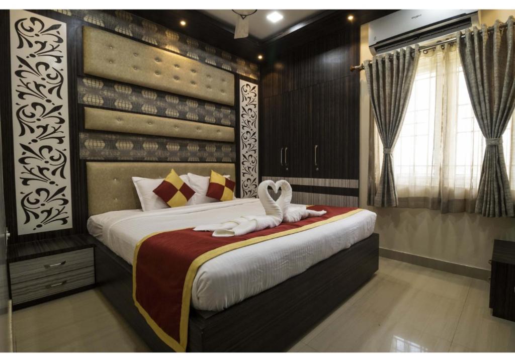 Ένα ή περισσότερα κρεβάτια σε δωμάτιο στο SR BOUTIQUEE STAY
