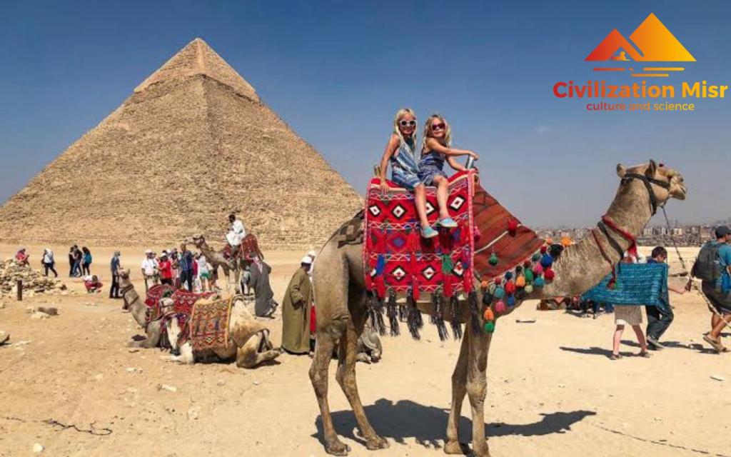 two people riding a camel in front of the pyramids at Civilization misr - Egypt pyramids view-Foreiigners only in Cairo