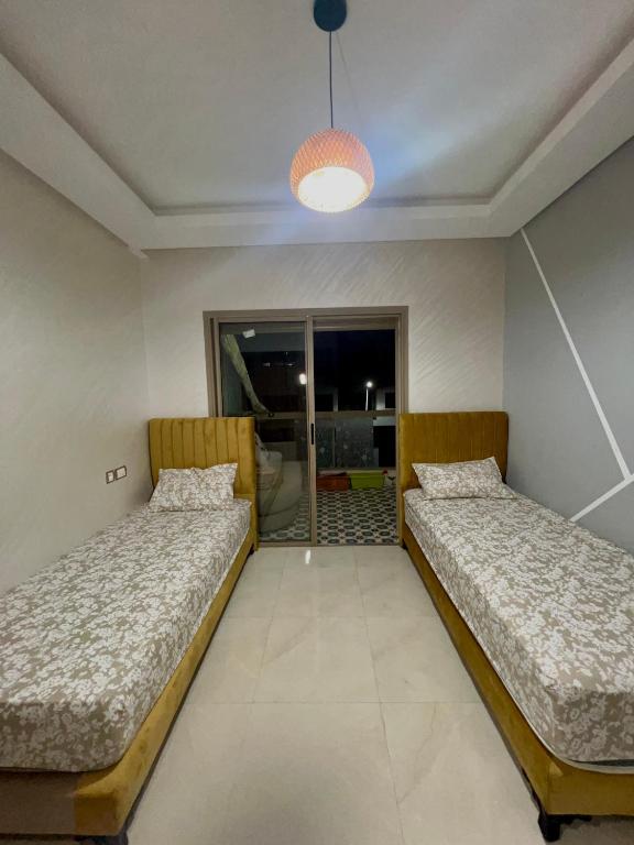 Ένα ή περισσότερα κρεβάτια σε δωμάτιο στο Appartement Chaleureux