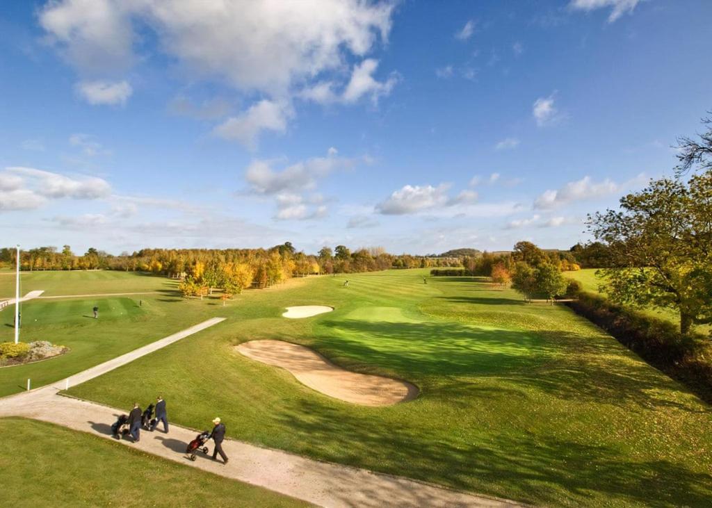 a group of people playing on a golf course at Elton Furze Retreats in Haddon