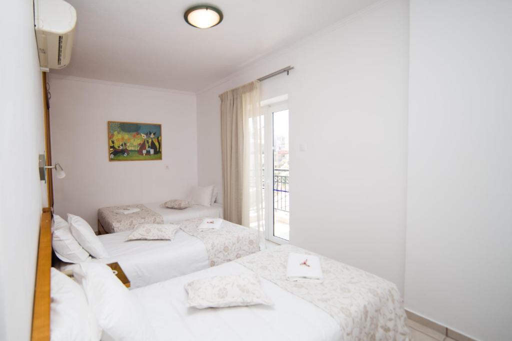 Posteľ alebo postele v izbe v ubytovaní Astali Hotel