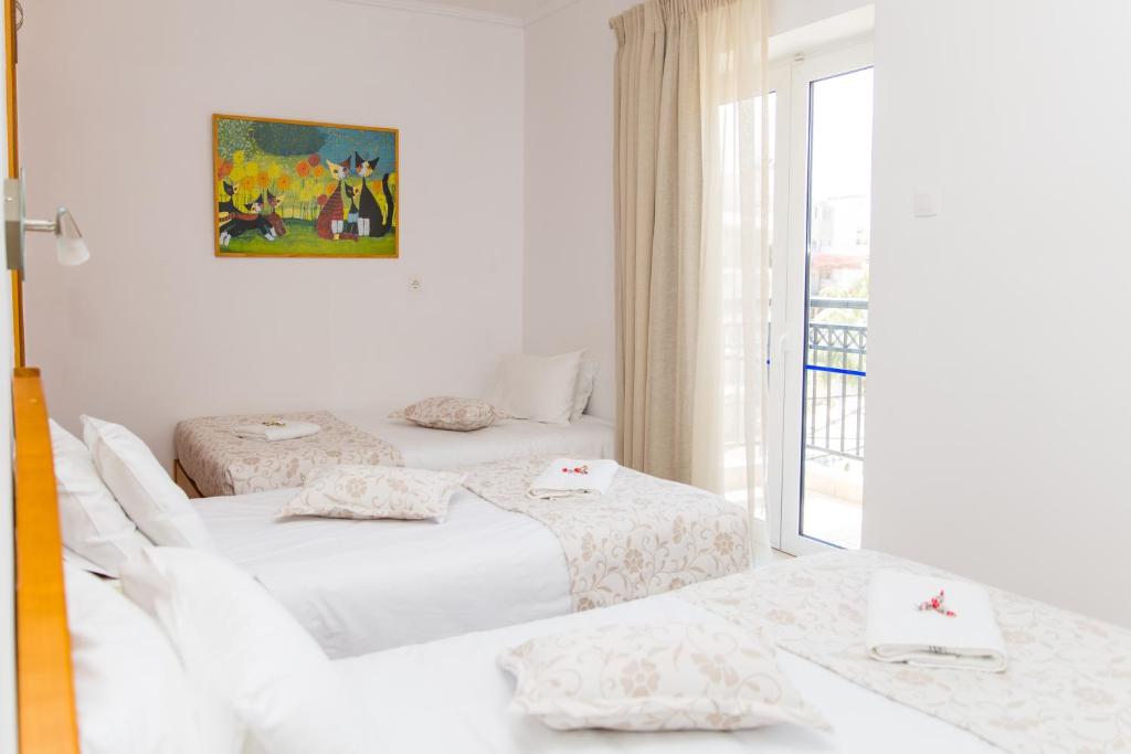 Posteľ alebo postele v izbe v ubytovaní Astali Hotel
