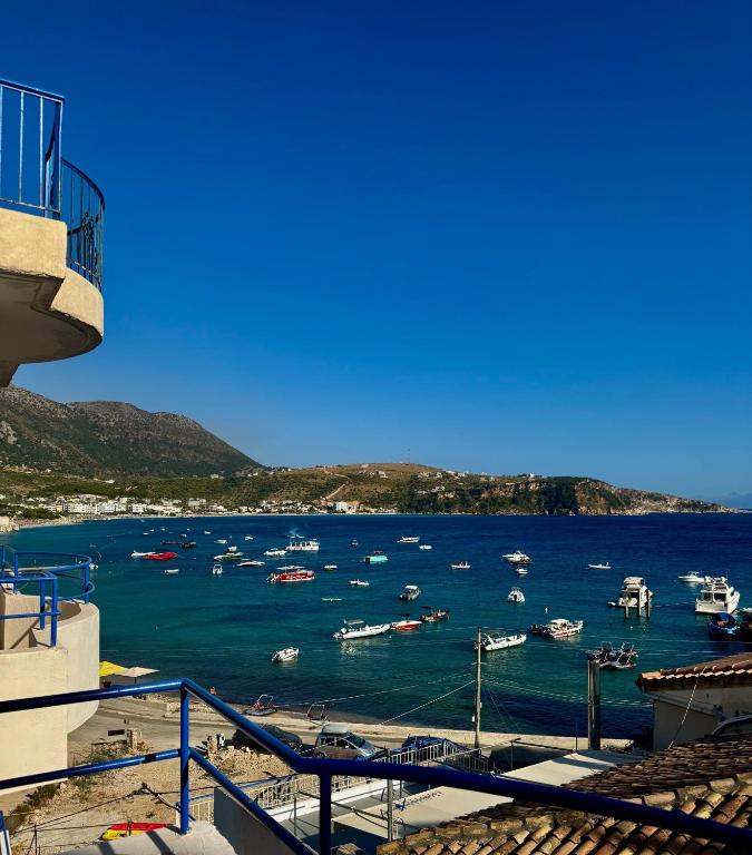 a view of a harbor with boats in the water at Harbour View Stay in Himare