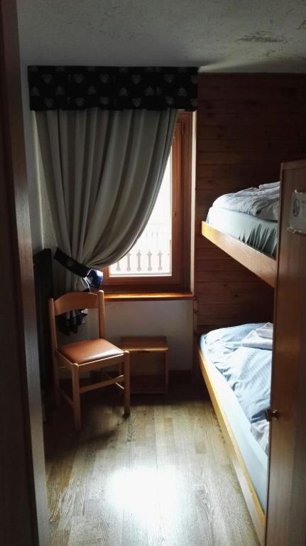 Postel nebo postele na pokoji v ubytování Rifugio Orso Bruno