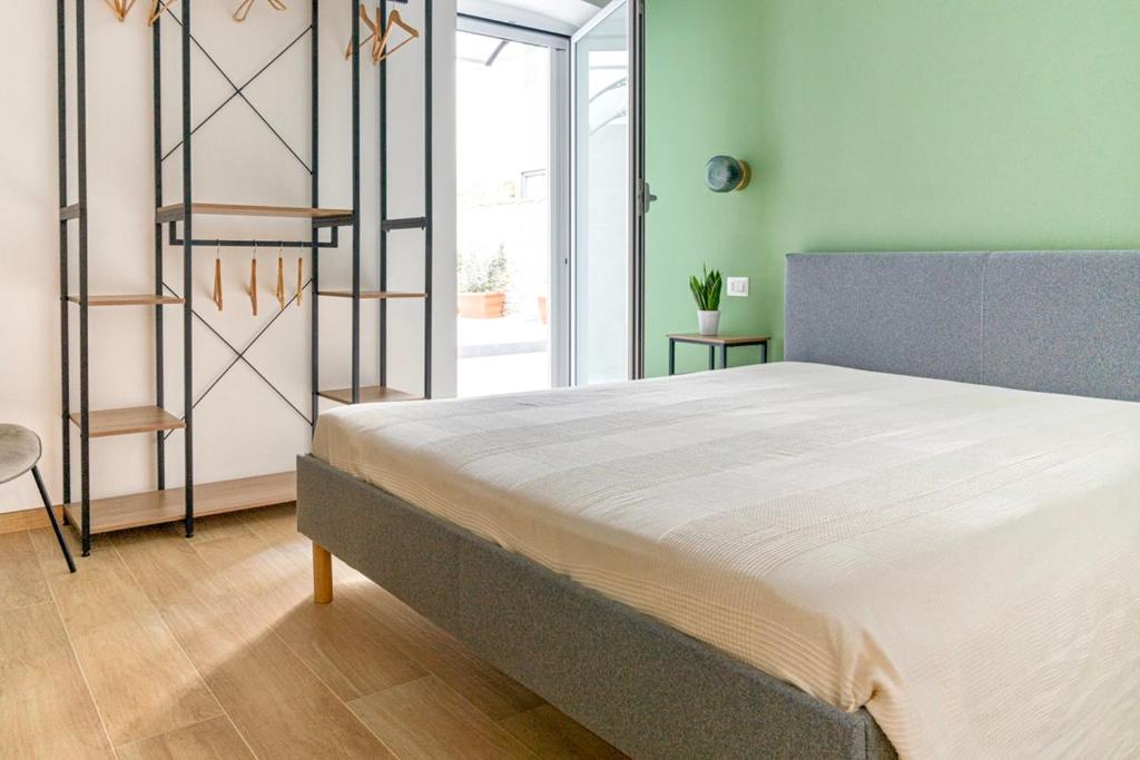 a bedroom with a large bed in a room at Casa Genzino in Molfetta