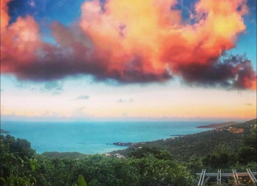 a view of the ocean under a cloudy sky at Casita Orquidea in Resolution
