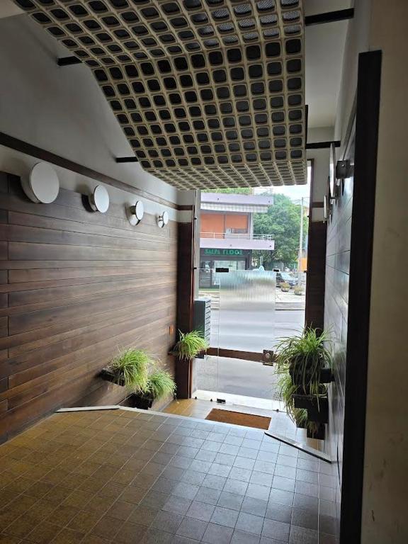 a hallway with potted plants in a building at Civico138 in Verona