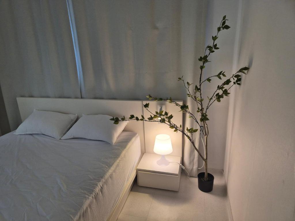 Ένα ή περισσότερα κρεβάτια σε δωμάτιο στο Stay ICHEON