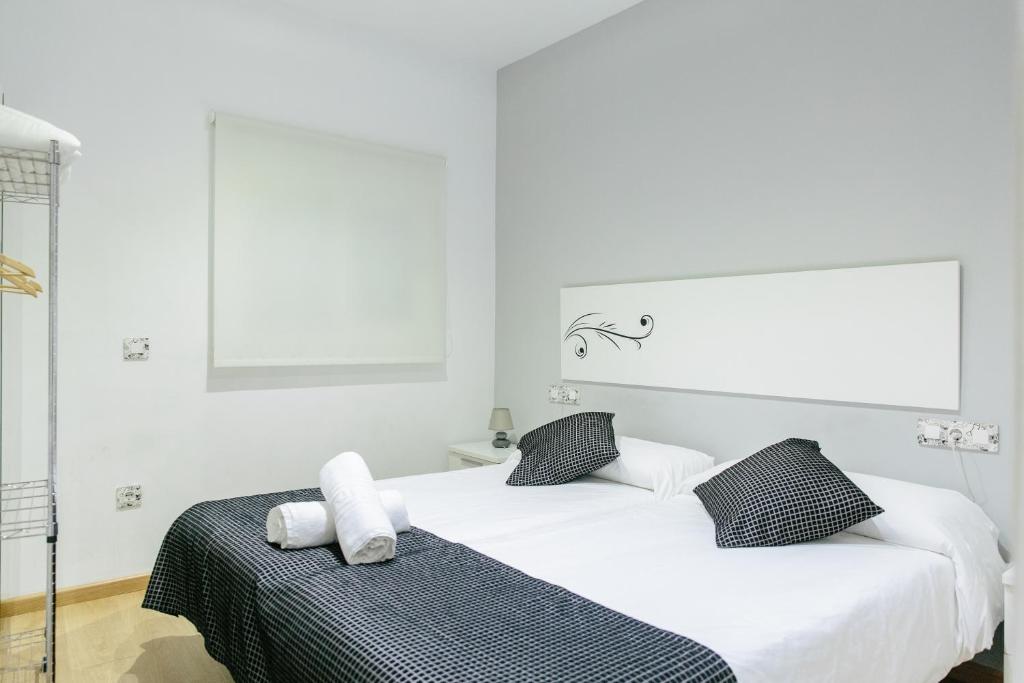 Postel nebo postele na pokoji v ubytování Apartamentos Tito San Agustin