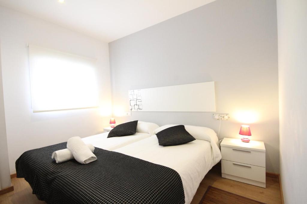 Postel nebo postele na pokoji v ubytování Apartamentos Tito San Agustin