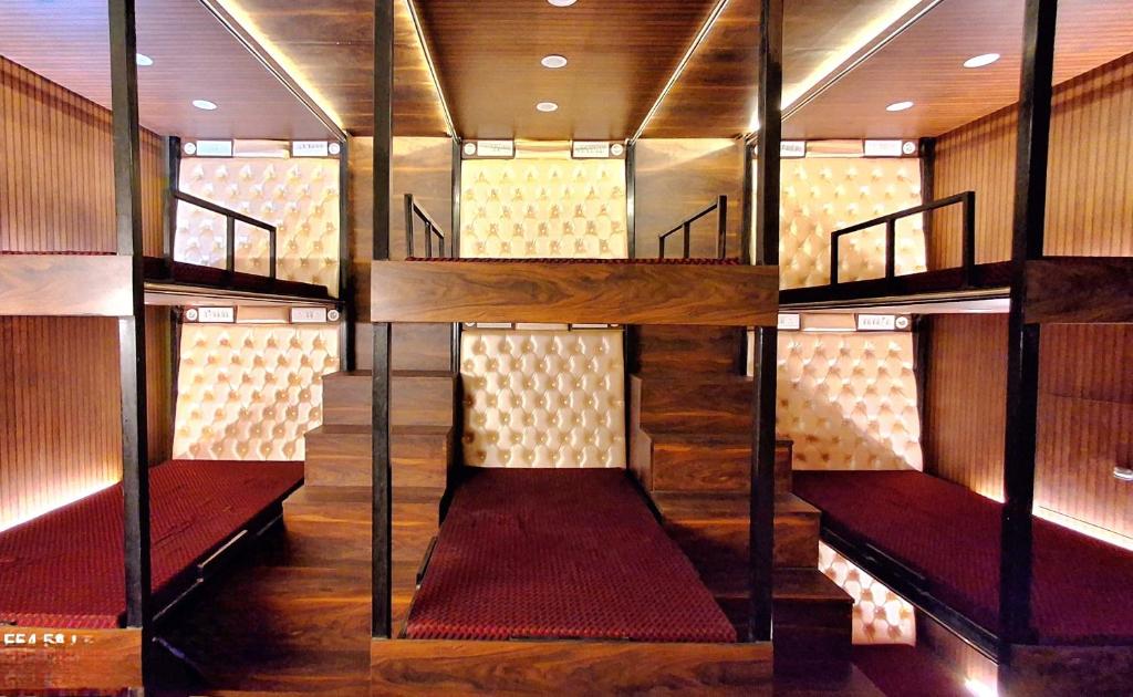 a room with several stairs in a room with red seats at Urbania- premium AC PG accommodation for Male in Baranagar