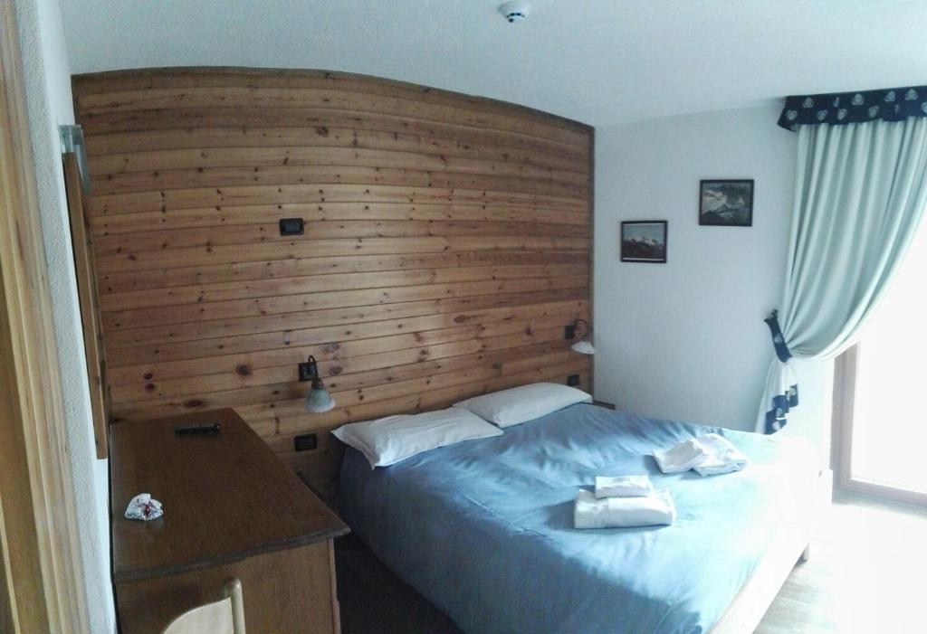 Postel nebo postele na pokoji v ubytování Rifugio Orso Bruno