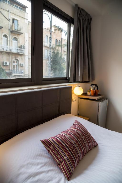Postel nebo postele na pokoji v ubytování Johnny Hotel