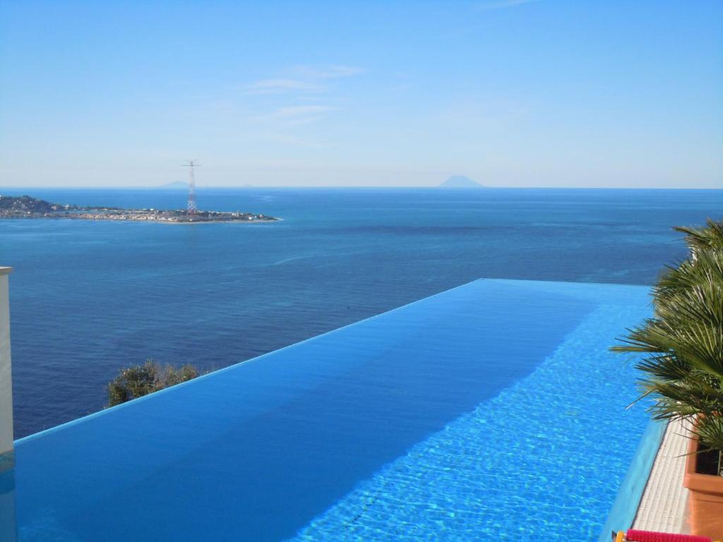a swimming pool with a view of the ocean at B&B Blu Infinito in Villa San Giovanni