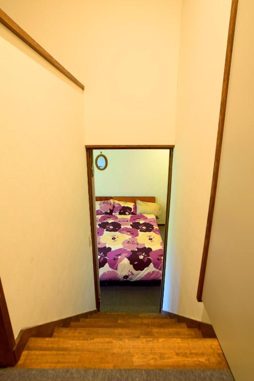 Postel nebo postele na pokoji v ubytování Chalet Myoko