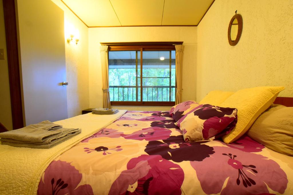 Postel nebo postele na pokoji v ubytování Chalet Myoko