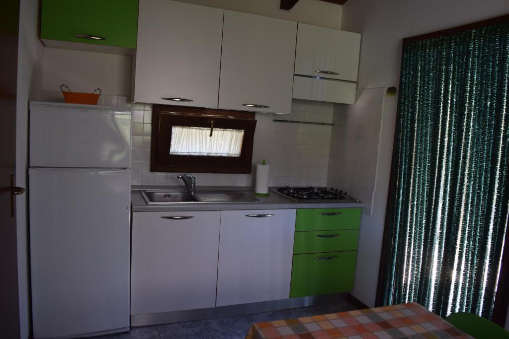 Kuchyň nebo kuchyňský kout v ubytování Blucamp Natural Village