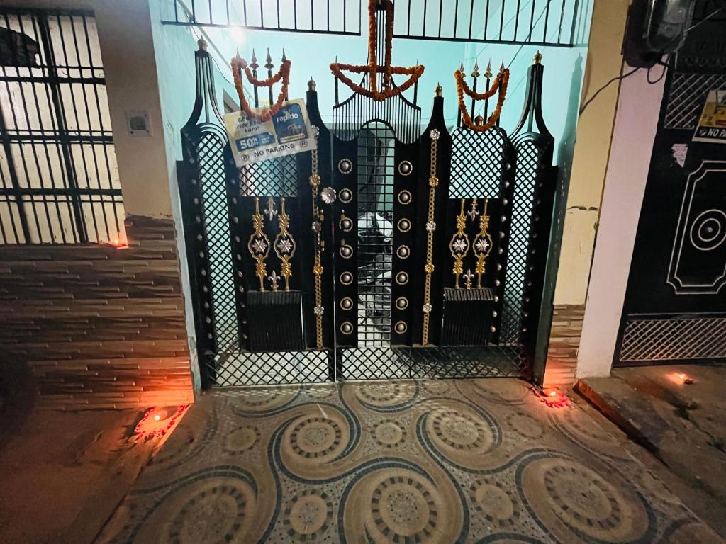 a gate with a picture of the city on it at Jaykishan sadan in Varanasi