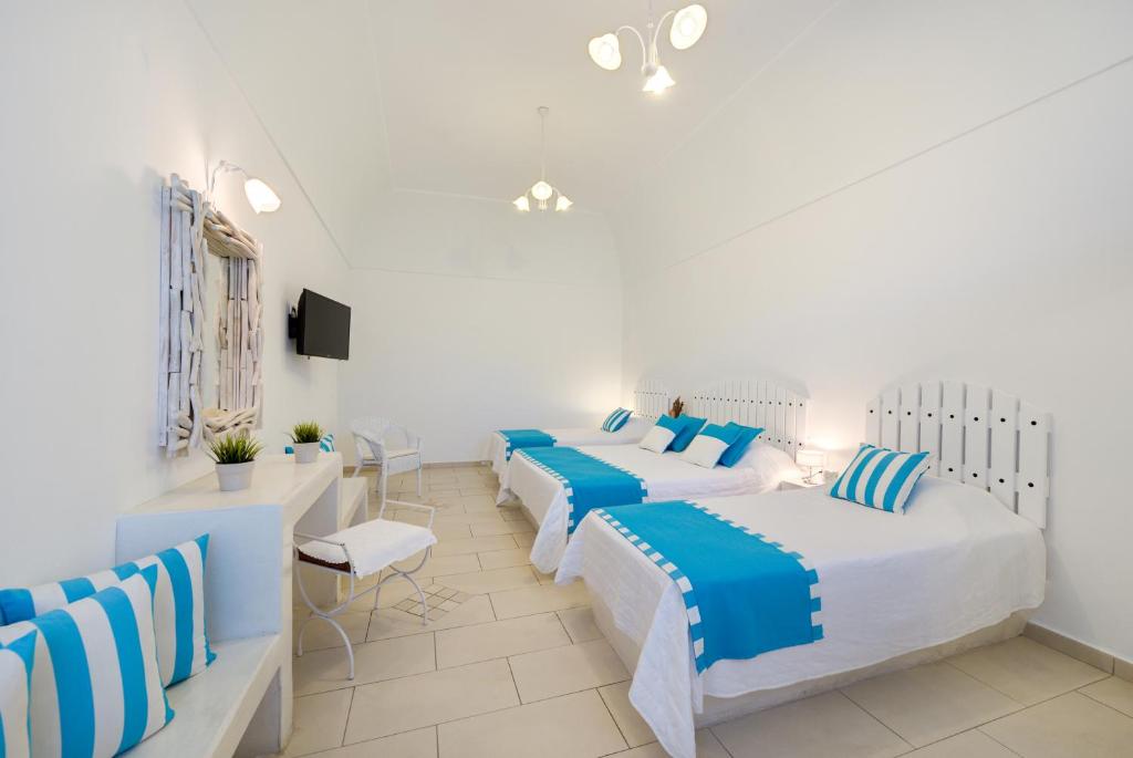 Postel nebo postele na pokoji v ubytování Dream Island Hotel