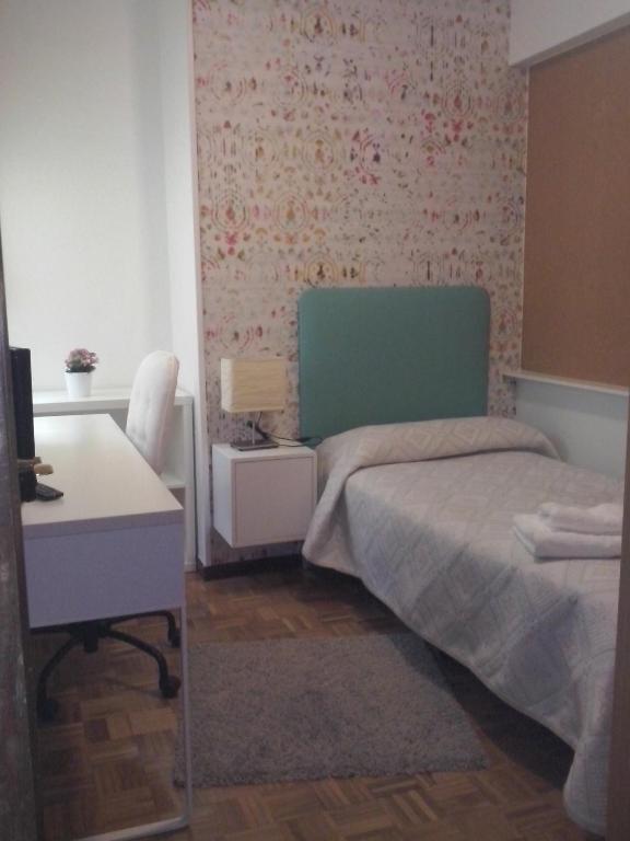 A bed or beds in a room at PR La Paz