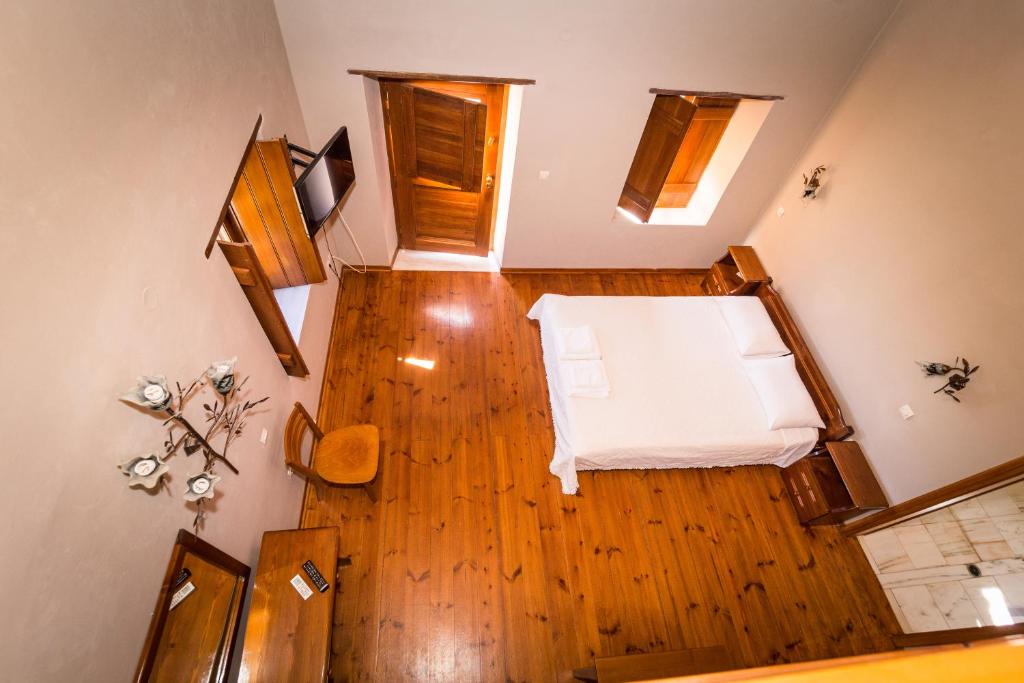 Postel nebo postele na pokoji v ubytování Lithochtisto